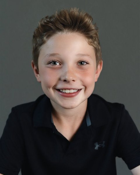 school portrait of a boy in a navy polo, Parker Colorado